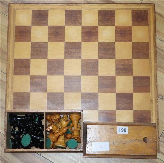 A Staunton pattern stained and natural chess set and board